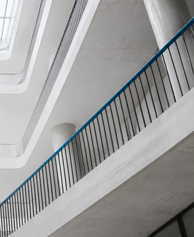 Balustrades and floor levels stepping back through an atrium